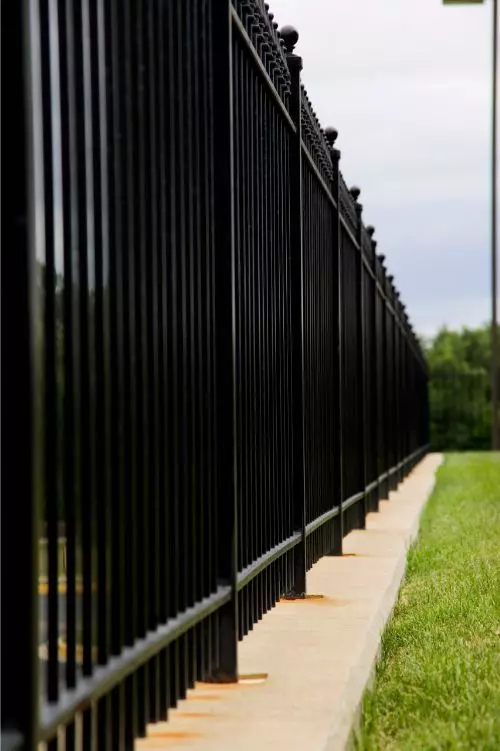 tall black metal fence repaired by port st lucie fence company